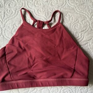 Born Primitive. Rust/burgandy color.